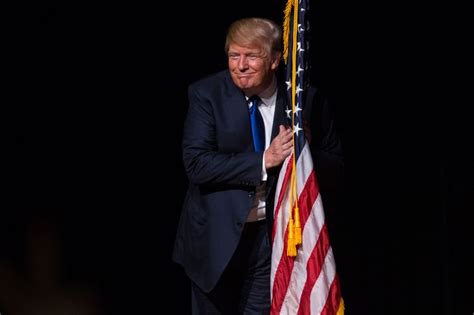 donald trump hugged  american flag
