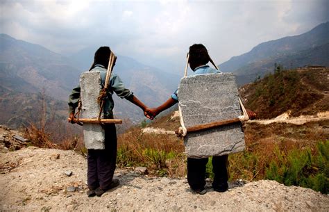 brothers carrying stone nepal lisa kristine