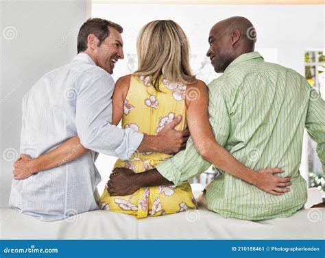 Rear View Of Woman Having Threesome With African And Caucasian Guy