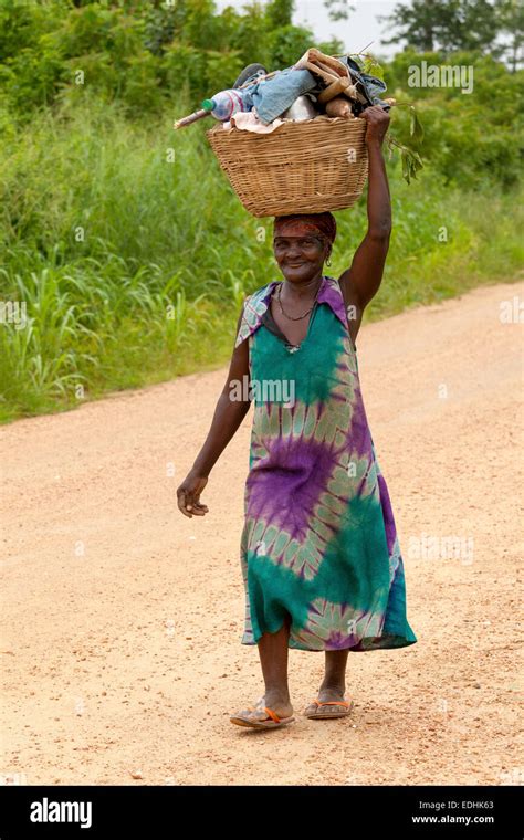 african woman carrying goods  head rural ghana africa stock photo alamy