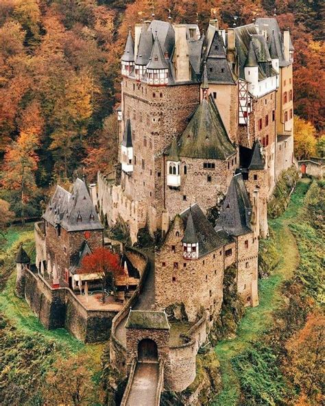 autumn  eltz castle burg eltz  medieval castle nestled   hills   moselle