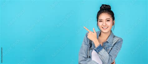 banner of happy asian woman standing pointing hands to copyspace on