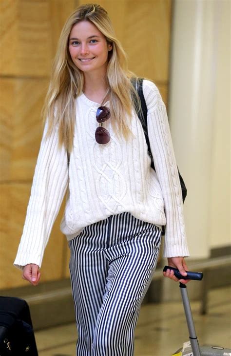 model bridget malcolm arrives into sydney with the ‘no make up look