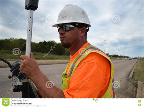 land surveyor  safety gear working   highway stock image image  land worker