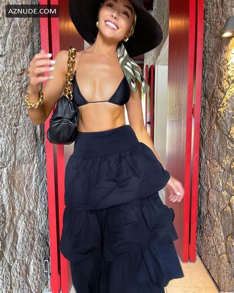 olivia culpo sexy wears a tiny black bikini top and hat in new social