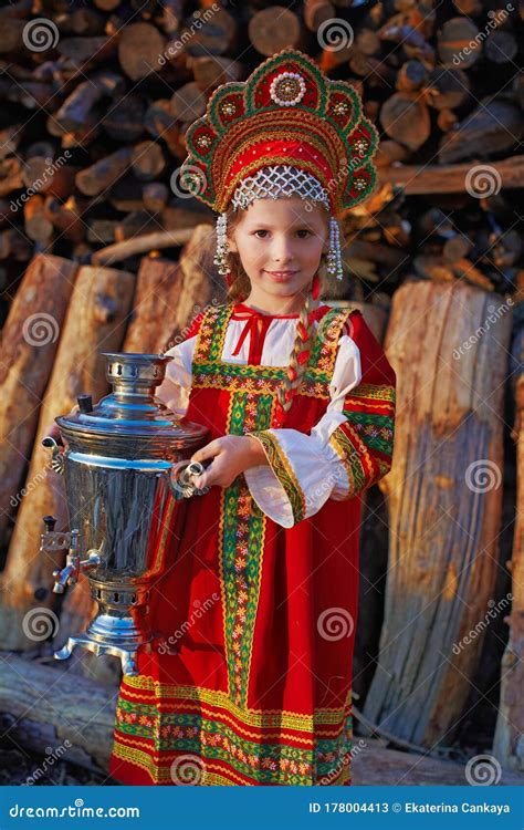 Small Cute Blonde Girl In Beautiful Traditional Russian Costume And