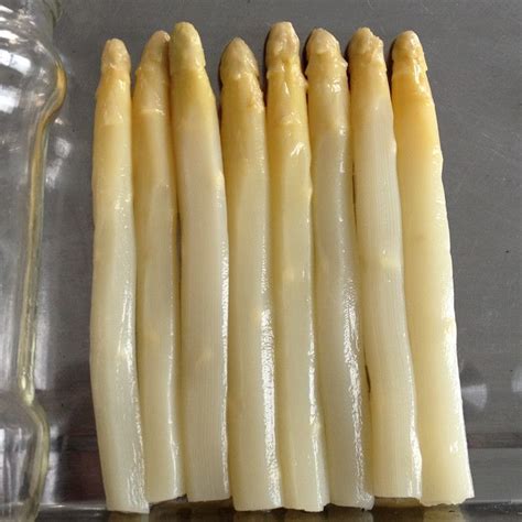 pieces  white asparagus sitting  top   counter
