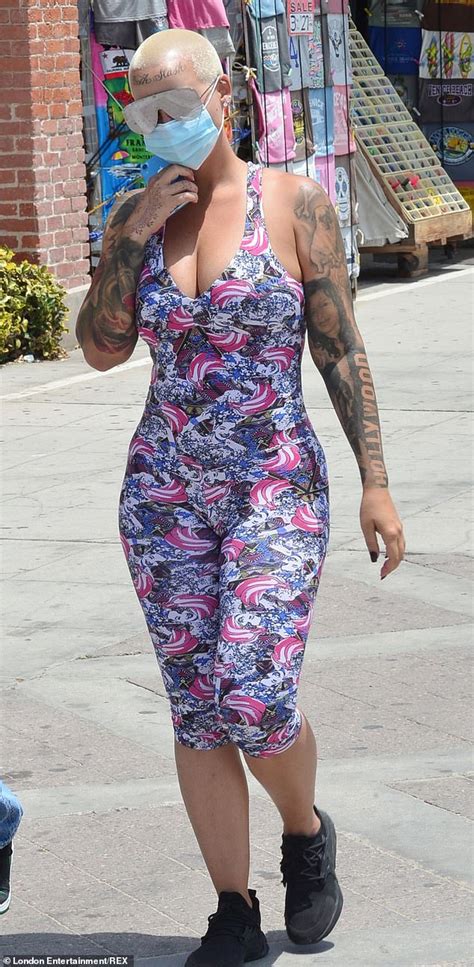 Amber Rose Put Her Curves On Display In A Plunging Bodycon Dress As She