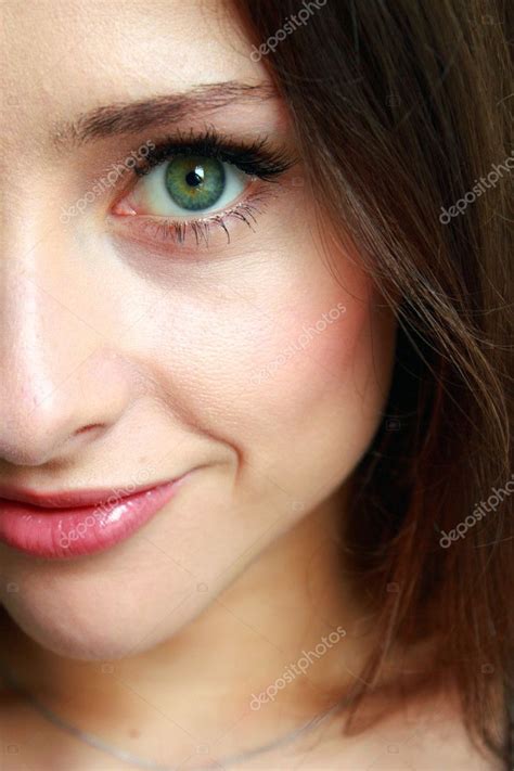The Macro Portrait Of Beautiful Girl With Big Green Eyes