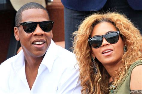 beyonce and jay z cuddle and lock lips by the sea in italy