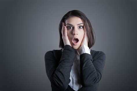 excited woman looking surprised and amazed speechless with mouth