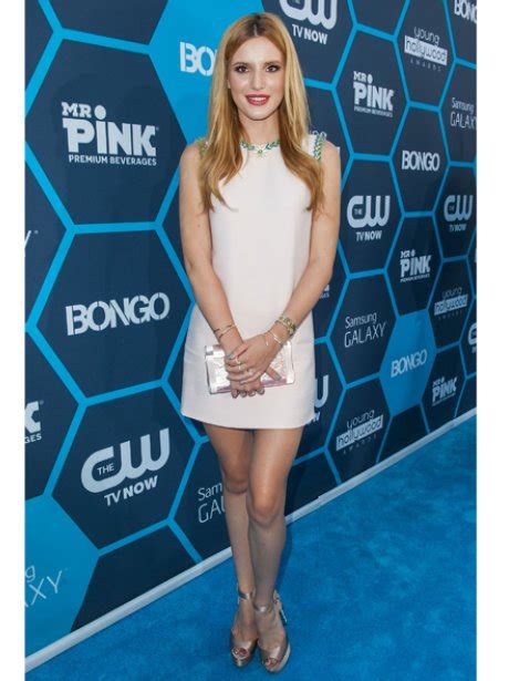 bella thorne flashes her pins in a chic embellished shift dress we love her 60s vibe heart
