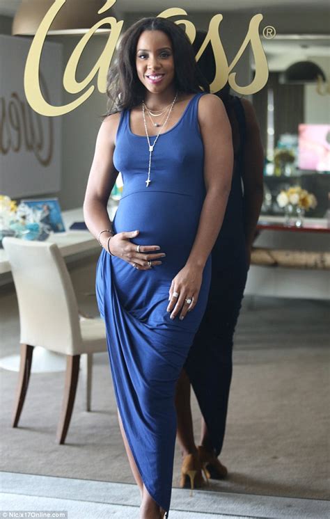 kelly rowland flashes smile as she holds pregnant belly in puerto rico daily mail online