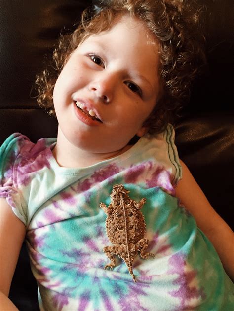 caleigh meets a horned toad — made of gray