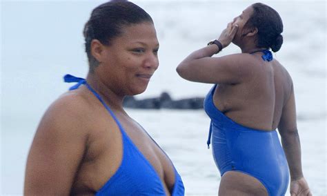 queen latifah busts out of an unflattering swimsuit during