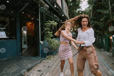 two lesbians having fun on the street stock image image of