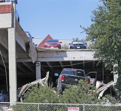 final  cars stranded  collapsed irving parking garage   pulled   crane
