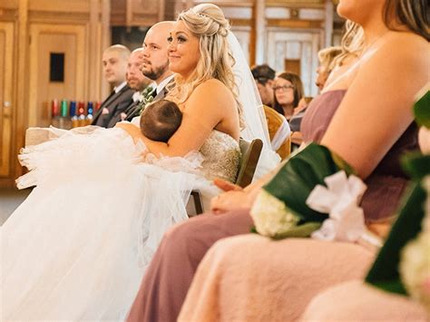 this photo of a bride breastfeeding during her wedding