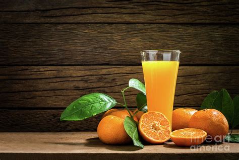 Still Life Glass Of Fresh Orange Juice On Vintage Wood