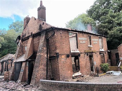 crooked house pub excavator  demolished historic building