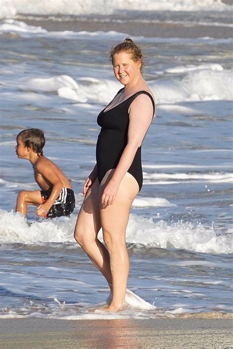 Amy Schumer Rocks Plunging Swimsuit As She Kisses Husband Photos