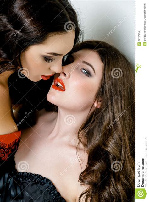 Portrait Of Two Gorgeous Women With Red Lips Moment Before