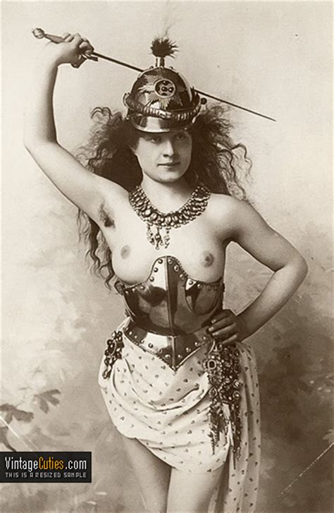 brunette in extravagant antique costume with soft boobs antique
