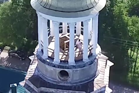 drone films couple having sex on church tower before being interrupted