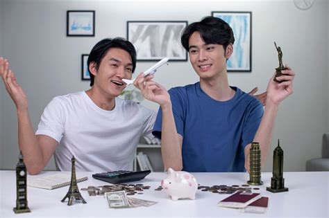 Young Asian Gay Couple Plans To Save Money For A Trip Around The World