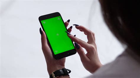 beautiful girl holding  smartphone   hands   green screen