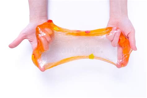 Girl Stretching Colorful Orange Slime On The Sides