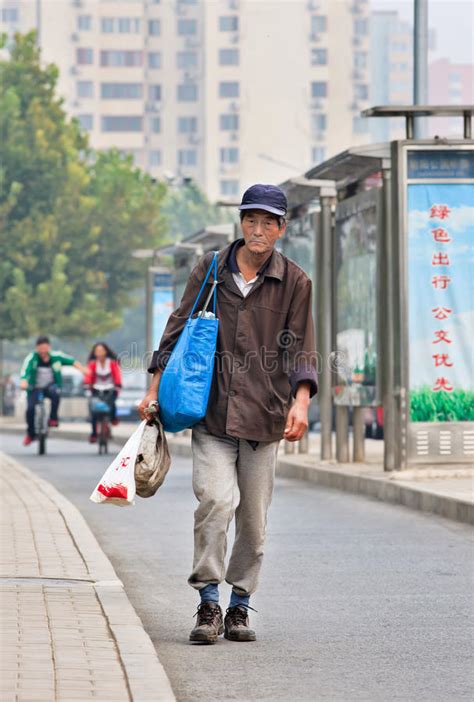 Homeless Man Walks On The Street Beijing China Editorial