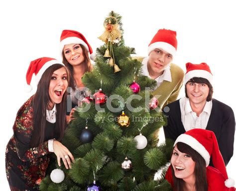 happy group people  santa hat  christmas tree stock photo
