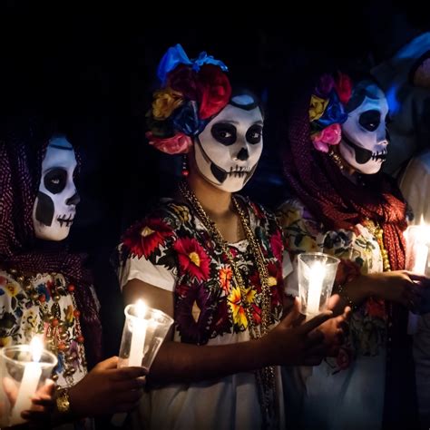 Three Women With Catrina Customes And Man With White