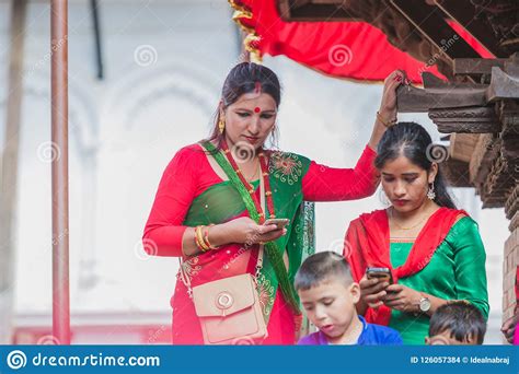 Nepali Hindu Women Using Mobile At Kathmandu Durbar Square In K