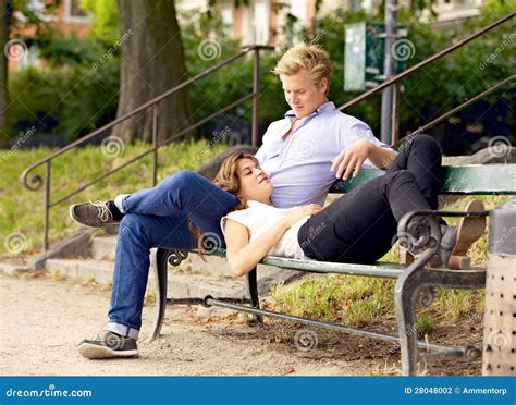 man    girlfriend resting   lap stock photography