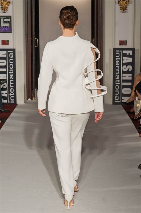 white crepe trouser suit  single bracelet arm lenie boya fashion designer