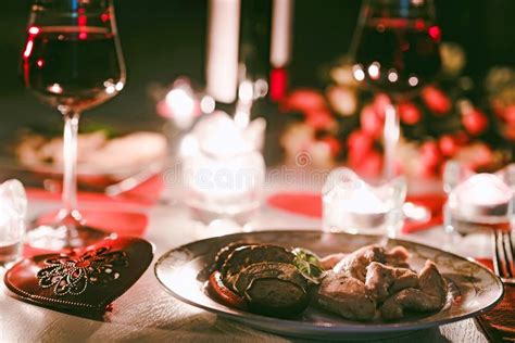 romantic dinner glass of red wine and candles stock image image of