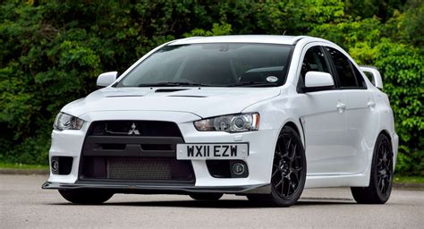 uk celebrates  decades  mitsubishi lancer evos carscoops