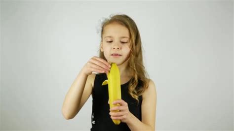 Girl Dances With A Banana A Girl Peels A Banana And Eats A Banana