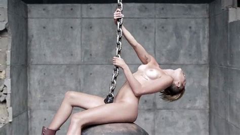 miley cyrus topless behind the scenes of wrecking ball scandal planet
