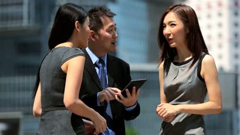 group male female asian chinese business people meeting talking