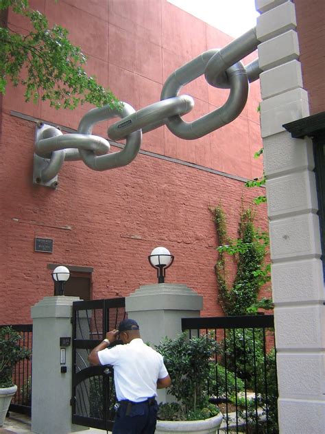 giant chain holding   buildings  work  artist blue