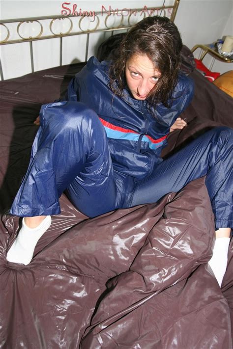 Woman Getting Hot And Bothered In A Pile Of Shiny Nylon