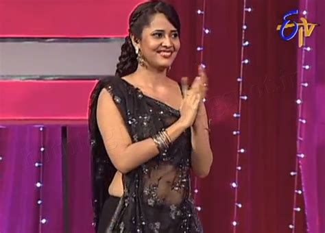 anasuya hot navel show in black saree s4telugu