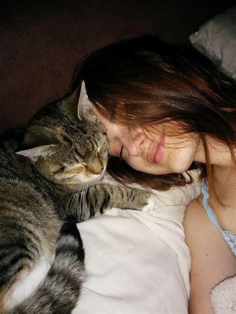cat loves her human so much she hugs and watches over her every step of