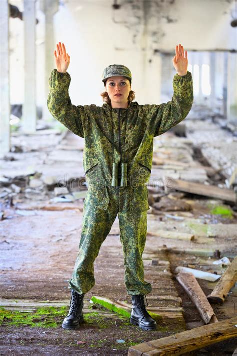 The Woman In Military Uniform Surrenders Stock Image