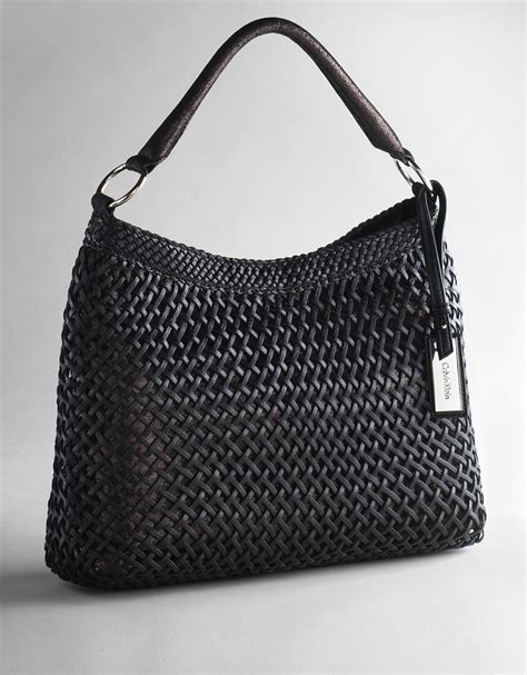 woman woven leather bag iucn water