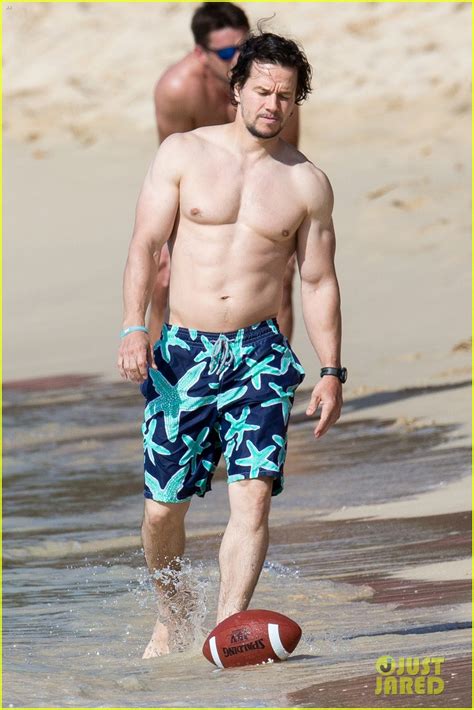 daddy mark wahlberg serving muscles shirtless on the beach