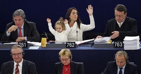 vote   daughter raises  hand   mom